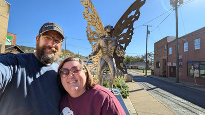 Matthew and Paige Partsch in front of the Mothman statue in Point Pleasant