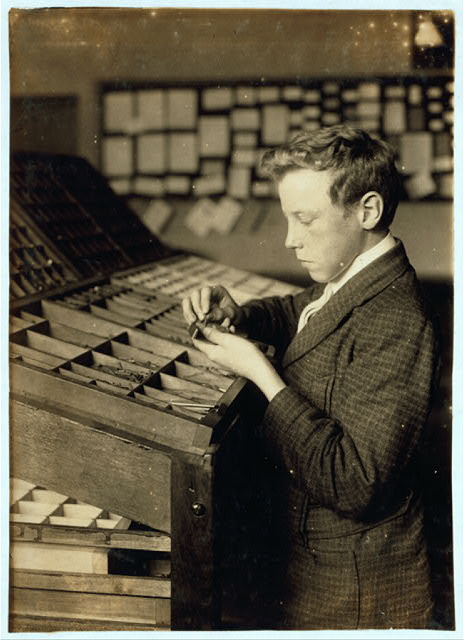 Boys setting type by hand at printers' type cases in a vocational typesetting class, Fall River, Massachusetts, June 1916