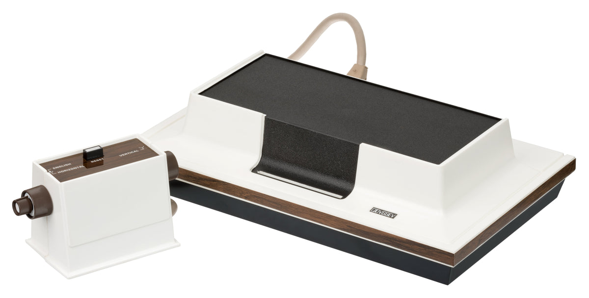 A 1972 Magnavox Odyssey console with its controllers, plastic game cards, and screen overlays