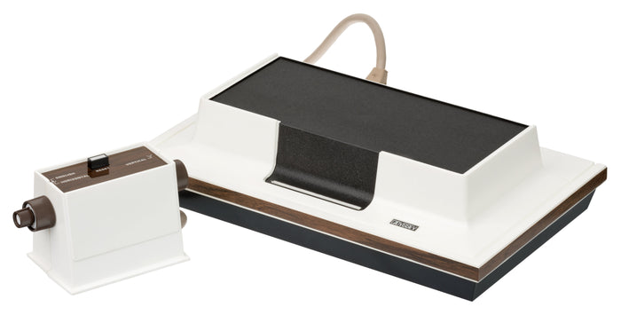 A 1972 Magnavox Odyssey console with its controllers, plastic game cards, and screen overlays