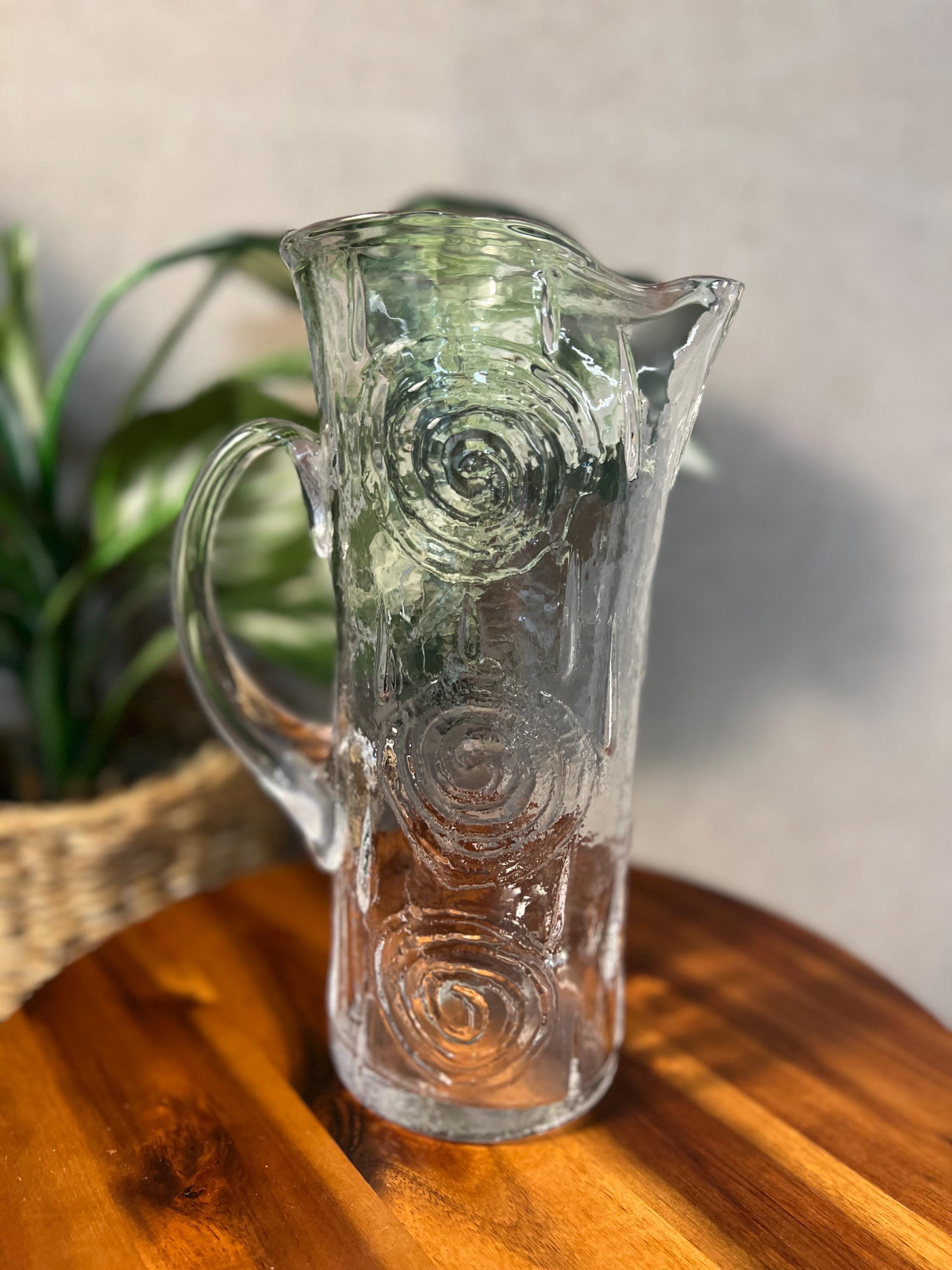 Swedish glass carafe from Björkshult is designed by Carl-Einar Borgström