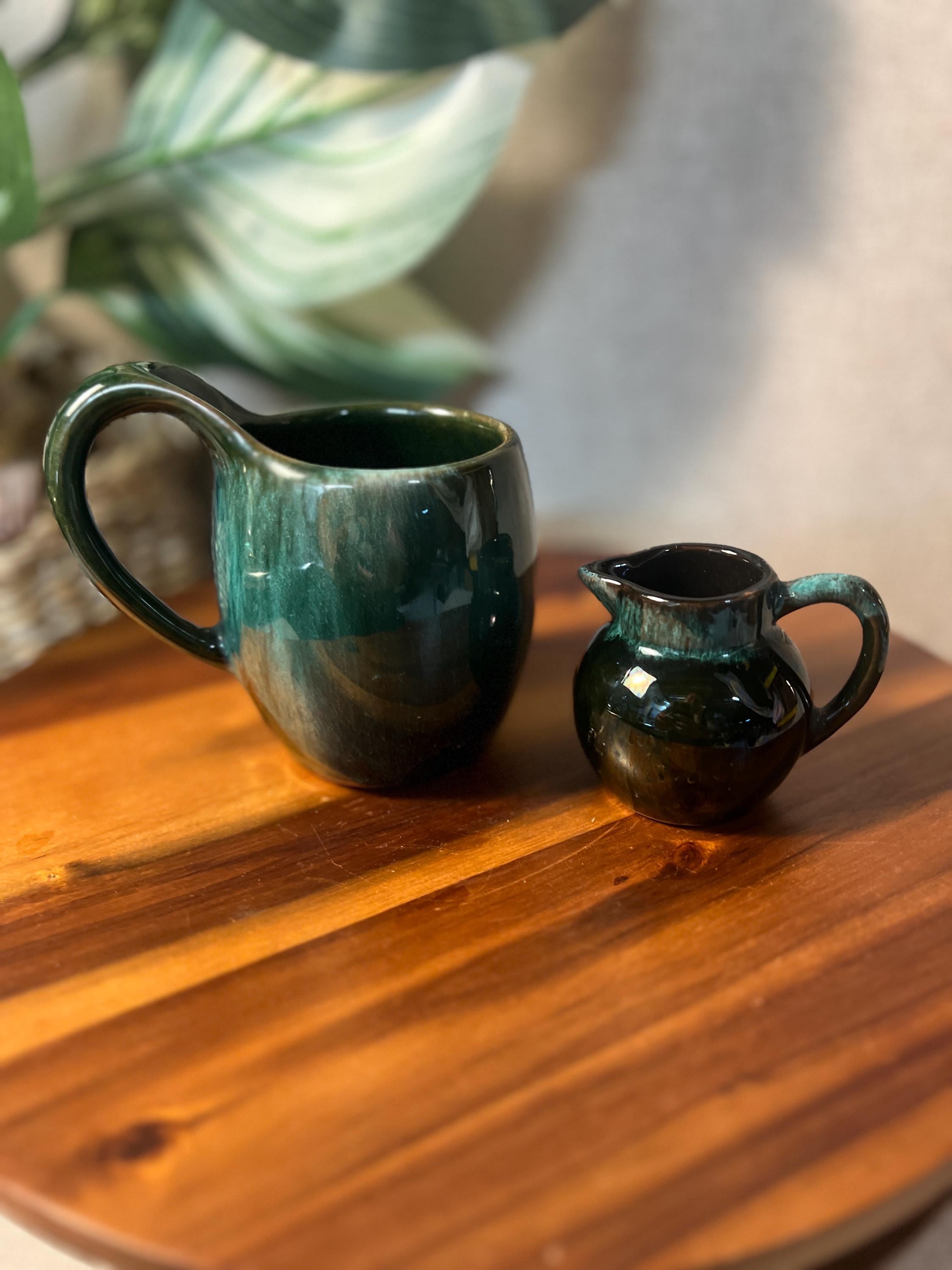 Handmade pottery pitcher and matching mug